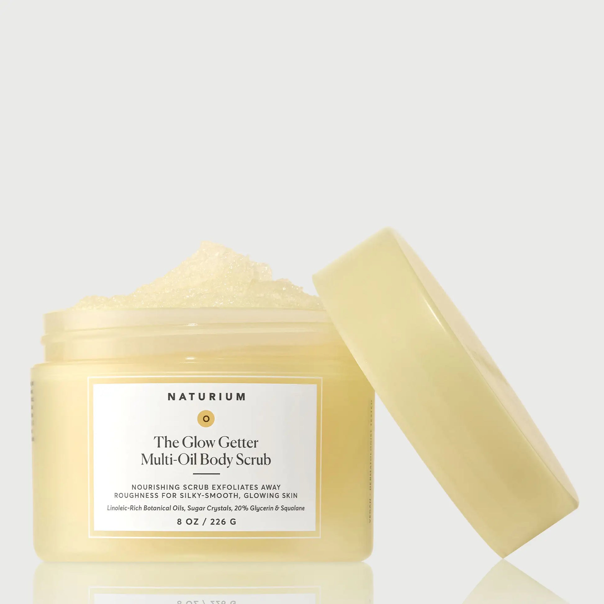 the-glow-getter-multi-oil-body-scrub-e8 NATR-40028-GlowGetter-Multi-Oil-Body-Scrub-Front-CapOff-bonebkgd.webp